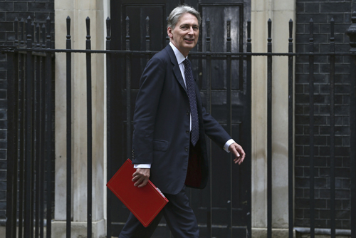 Britain's Chancellor of the Exchequer Philip Hammond arrives for a meeting of the ‘Cabinet Committee on Economy and Industrial Strategy’ at Number 10 Downing Street in London, Britain, on August 2 (Reuters photo)